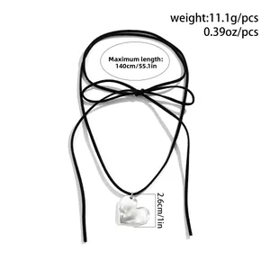 Detail view of adjustable black cord necklace with heart pendant and dimensions