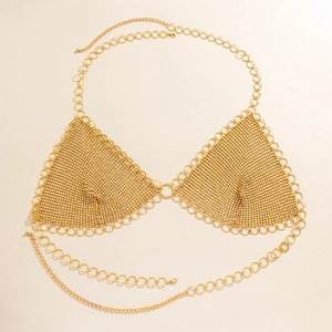 Close-up of golden mesh bikini body chain with sequins and adjustable metal ring straps