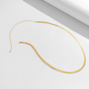 Close-up of double-layer snake chain with gold and silver flat links and lobster clasp
