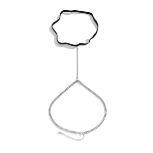 Detailed view of silver rhinestone leg chain with black elastic band and lobster clasp