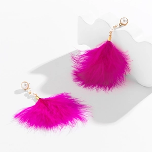 Detail of rose red feather tassel earrings with pearl studs and golden metallic accents
