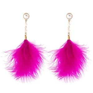 Detail view of fuchsia feather tassel earrings with elegant white faux pearls and gold chains