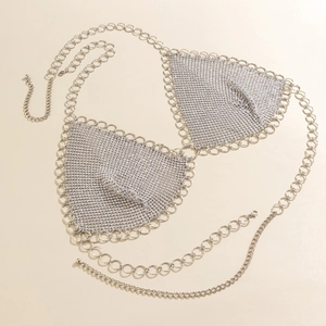 Detail of silver rhinestone mesh bikini top with star sequins and large metal rings