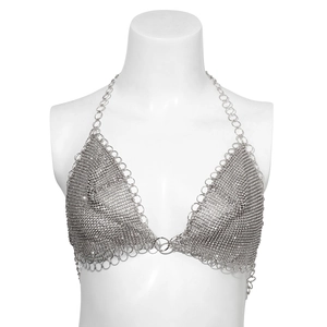 Macro detail of silver mesh body chain featuring sparkling rhinestones and metal rings