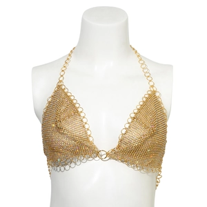 Close-up of gold tassel body chain with shimmering rhinestones and star sequins