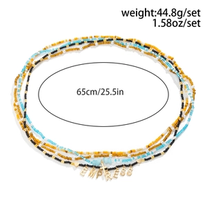 Detail of colorful multi-layer beaded waist chain set with EMPRESS charm and charms