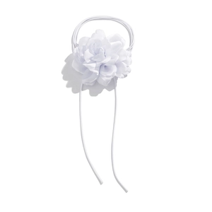 Detailed macro view of layered white fabric flower petals with adjustable lace-up ribbon