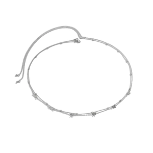 Detail view of double-layer silver waist chain featuring butterfly and metal bead charms