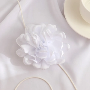 Close-up of elegant 3D white fabric flower choker with long adjustable ribbon ties