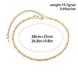 Detail of gold double-layer waist chain with size measurements and lobster clasp