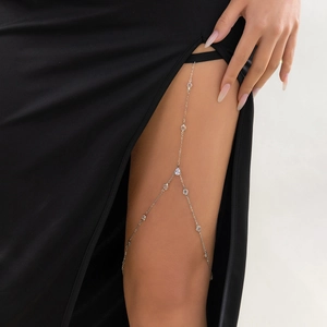 Minimalist silver leg chain with zircon tassels and elastic band on female model