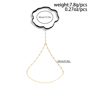 Detail view of gold beaded thigh chain with black elastic band and size measurements