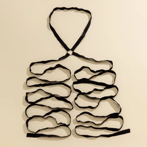 Detail of multi-layer elastic black leg harness chain with silver metal ring connectors