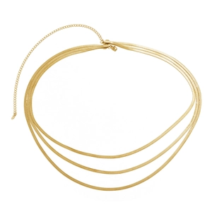 Detail of triple-layered golden snake chain with adjustable extender and lobster clasp