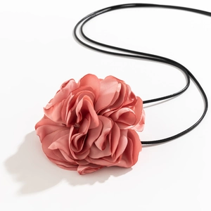 Detail of coral pink fabric 3D flower choker necklace with black long adjustable rope