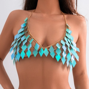 Detail shot of golden mesh body chain with iridescent turquoise diamond sequins
