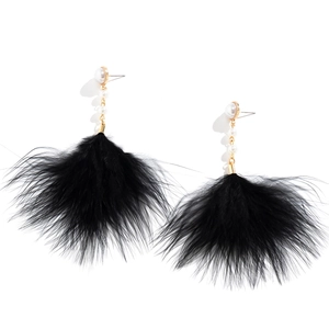 Vintage retro feather drop earrings with white pearls and gold chains on a white background