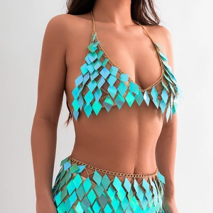 Detail of gold chain bikini body jewelry with iridescent green sequin diamonds