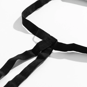 Macro detail of the triple-stitched elastic webbing on the sexy black leg chain thigh ring