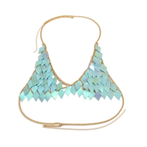Detail of gold body chain with shimmering light blue diamond-shaped sequins and halter link