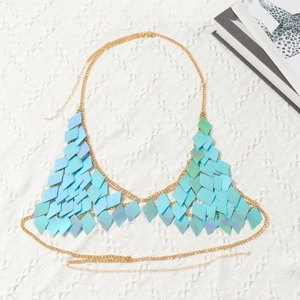 Detail of light blue iridescent sequins and gold chain mesh on a party body chain