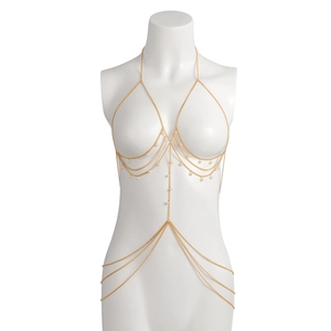 Detail of gold multi-layer body chain with butterfly tassels and white imitation pearls