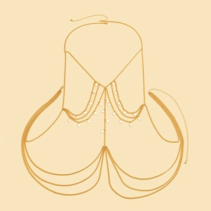 Detail of gold-layered body chain featuring hanging metal pentagram stars and fringes