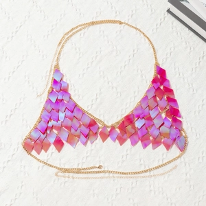 Detail of rose pink iridescent diamond sequins and gold chain bikini body jewelry