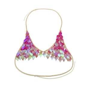 Detailed macro view of iridescent diamond sequins on a golden metallic body chain