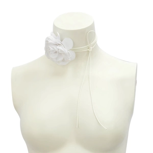 Close-up of white 3D fabric rose flower choker with multi-strand lace-up neck straps
