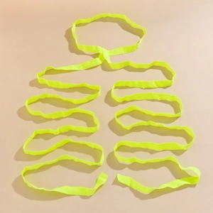 Detail of neon yellow elastic leg chain bands arranged in a creative ribcage shape