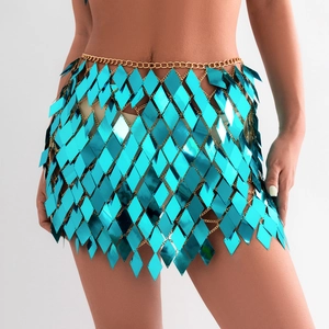 Close-up of blue diamond sequins and gold metal chain link on a fashion body skirt