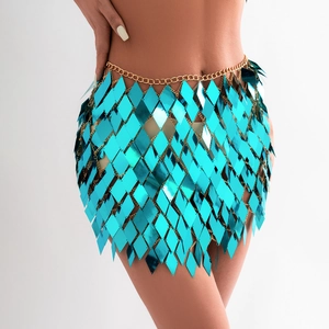 Close-up of bright blue sequin body chain with diamond-shaped scales and gold links