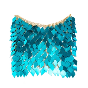 Close-up of blue diamond sequins and gold chain in a layered fish-scale body chain design