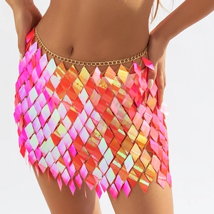 Close-up of pink iridescent sequin body chain with golden metal links on a model