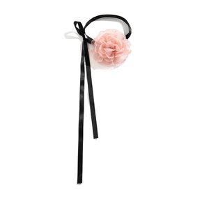 Detail of light pink organza flower choker with black satin ribbon and delicate petals