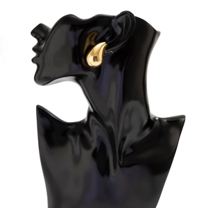 Polished gold teardrop earrings worn on a black bust to show realistic size and fit