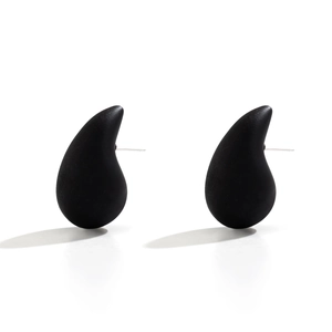 Close-up of matte black waterdrop stud earrings with sleek minimalist design
