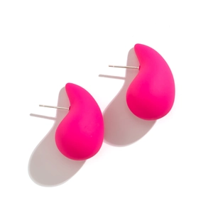 Macro shot of matte magenta teardrop earrings with silver metal posts on white background
