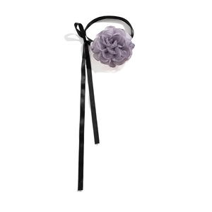 Detail of lavender chiffon flower choker with long black satin ribbon tassel