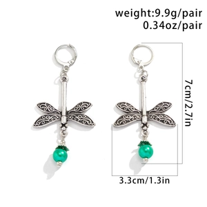 Detailed dragonfly drop earrings with filigree wings and green faux opal bead detail