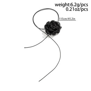 Detail of black fabric 3D flower choker with long adjustable ribbon and soft texture