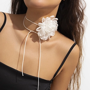 Close-up of white fabric flower choker necklace with long adjustable ties on model