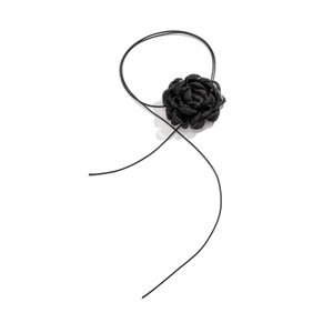 Detailed macro view of a 3D black fabric rose choker with delicate adjustable ribbons