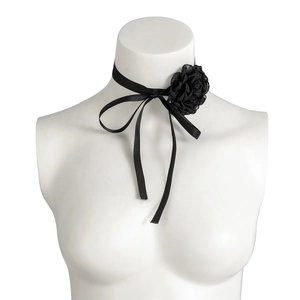 Detail of a large black fabric rose choker with long satin ribbons on a white mannequin