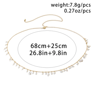 Macro shot of gold-tone waist chain featuring faux pearls and flower charms, 68+25cm length