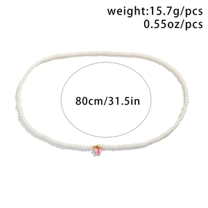 Detail view of pearl body chain with pink butterfly pendant, 80cm length and 15.7g weight