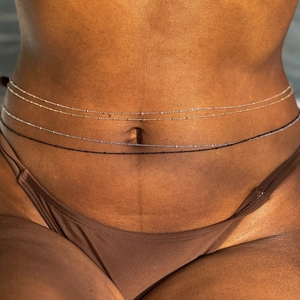 Set of four minimalist beaded waist chains in gold, silver, rose gold, and black for women