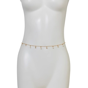 Detail of gold chain belt with faux pearls and pear-shaped rhinestones on a mannequin