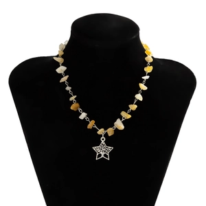 Detailed view of silver star Tree of Life pendant with yellow and white stone beads